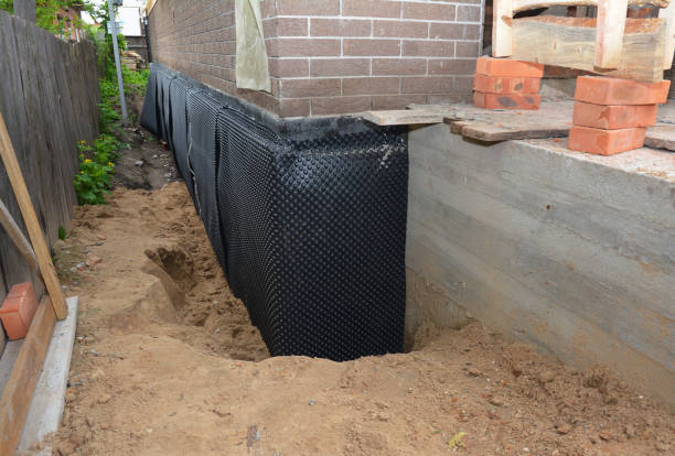Happy homeowners after waterproofing job in Waupun